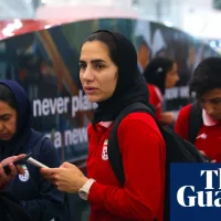 Two more Iranian football team members granted asylum in Australia as rest of squad land in Kuala Lumpur